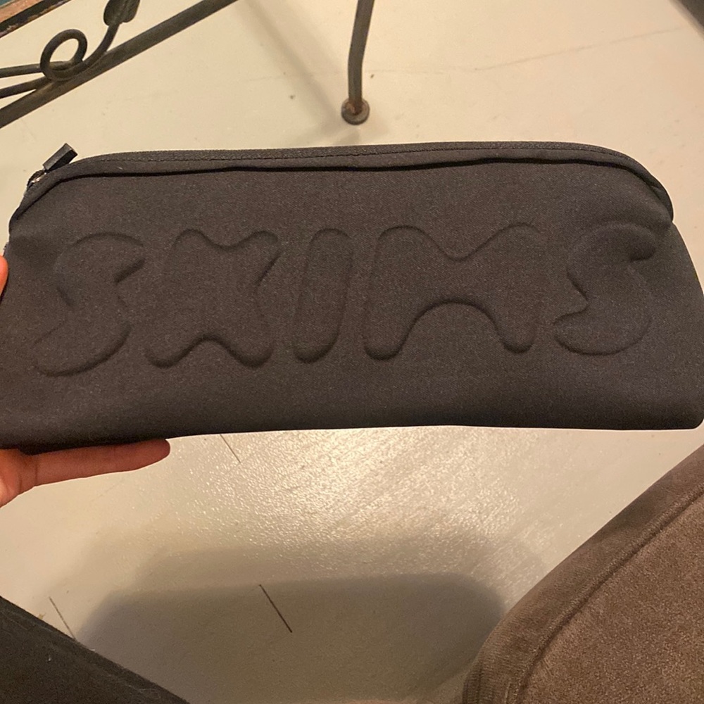 skims makeup bag